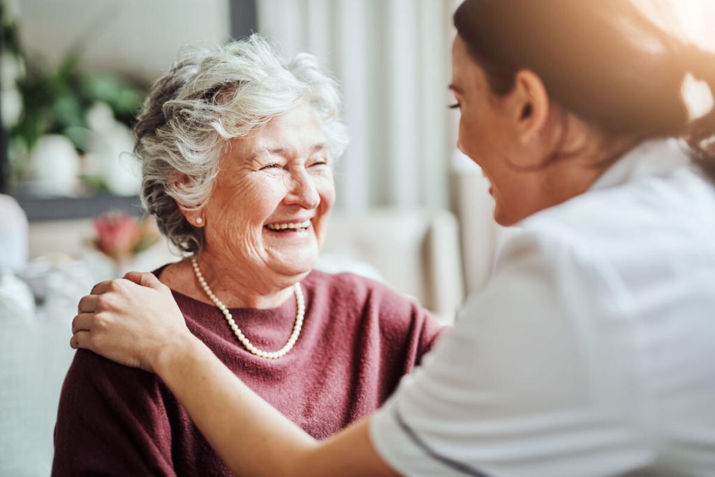 Young nurse caring for an elderly woman in a retirement home